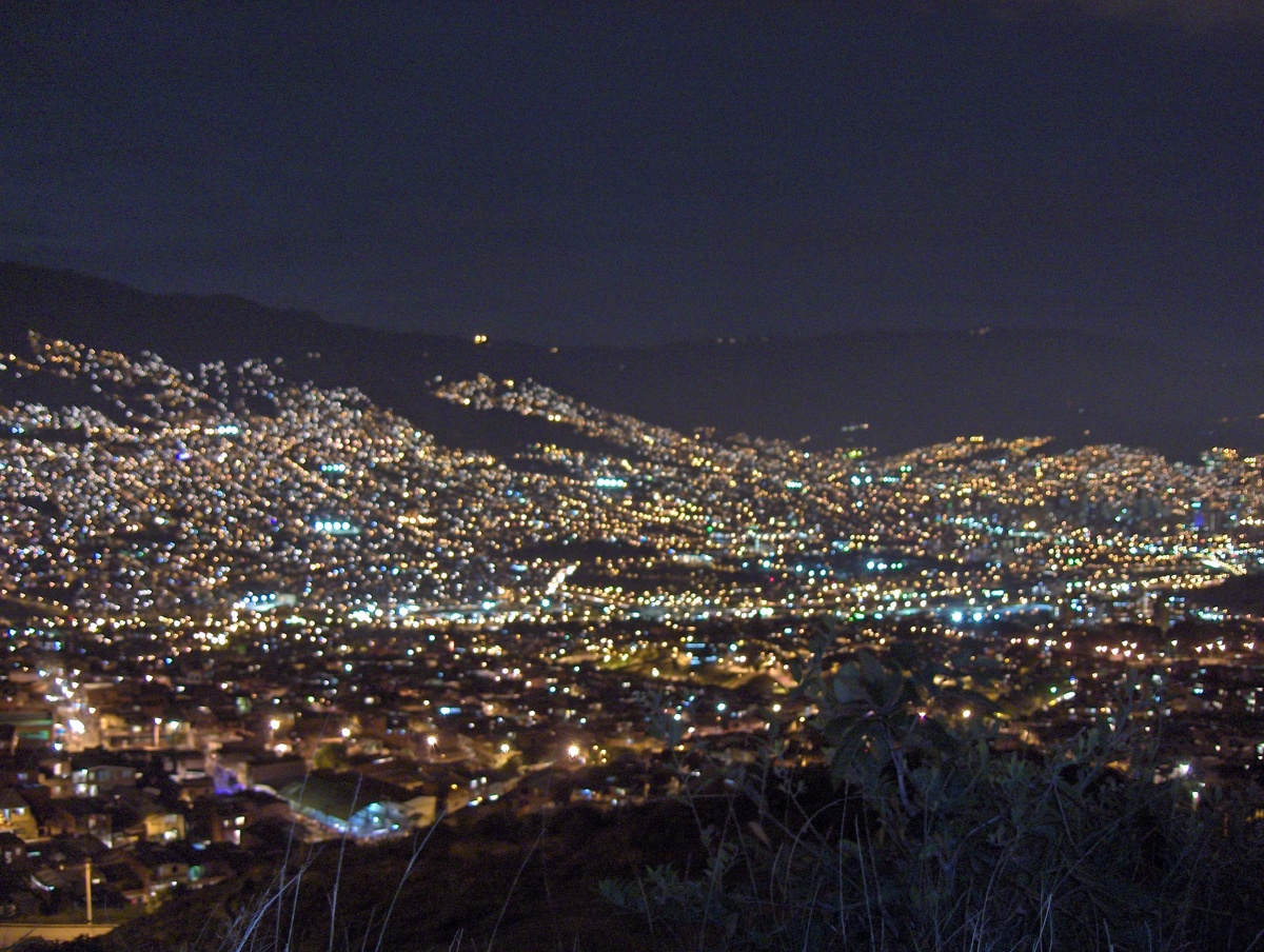 A view over Medellín at night. Photo: WikiArt